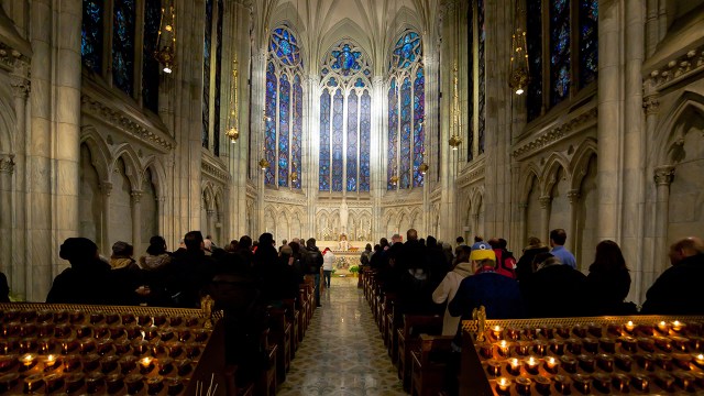 Catholic worshippers attend a New Year's Eve Mass at St. Patrick's Cathedral in New York City in 2016. (Artem Vorobiev/Getty Images)