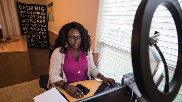 JeNae Johnson works at a computer in her home office. She is the president and CEO of CTM Unlimited, a company that helps workplaces change their corporate culture. (Brett Coomer/Houston Chronicle via Getty Images)