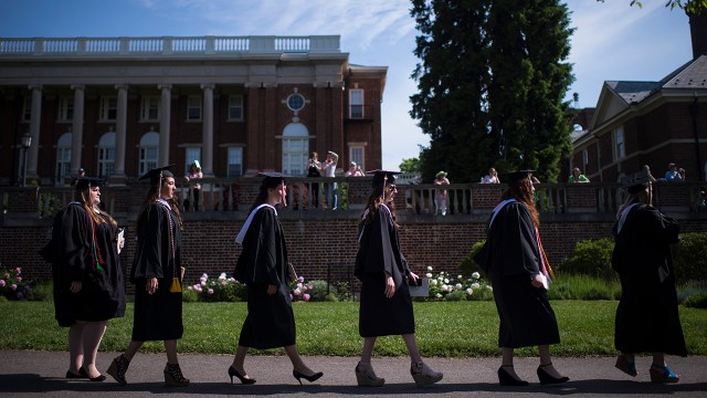 Seniors walk out during the 2015 commencement ceremony at Sweet Briar College in Virginia. The college nearly closed that summer following financial difficulties. (Jabin Botsford/The Washington Post via Getty Images)