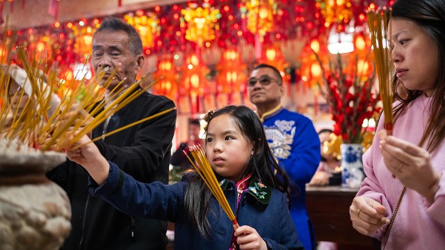 Buddhists seek blessings for the Lunar New Year as they welcome the Year of the Horse at Kwan Ying Vietnamese Buddhist Temple in Los Angeles on Feb. 17. (Sarah Reingewirtz/MediaNews Group/Los Angeles Daily News via Getty Images)