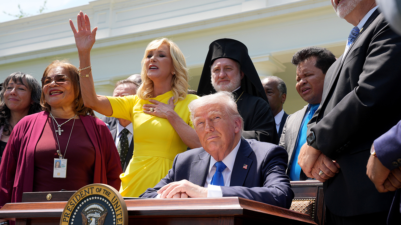 Photo: White House Faith Office Senior Adviser Paula White-Cain sings next to President Donald Trump during a National Day of Prayer event at the White House, attended by religious leaders of different faiths, on May 1, 2025. (Andrew Harnik/Getty Images)