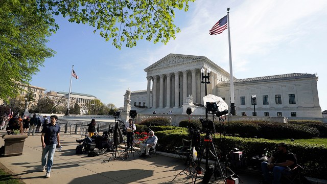 Reporters set up outside the U.S. Supreme Court on April 1. (Al Drago/Getty Images)